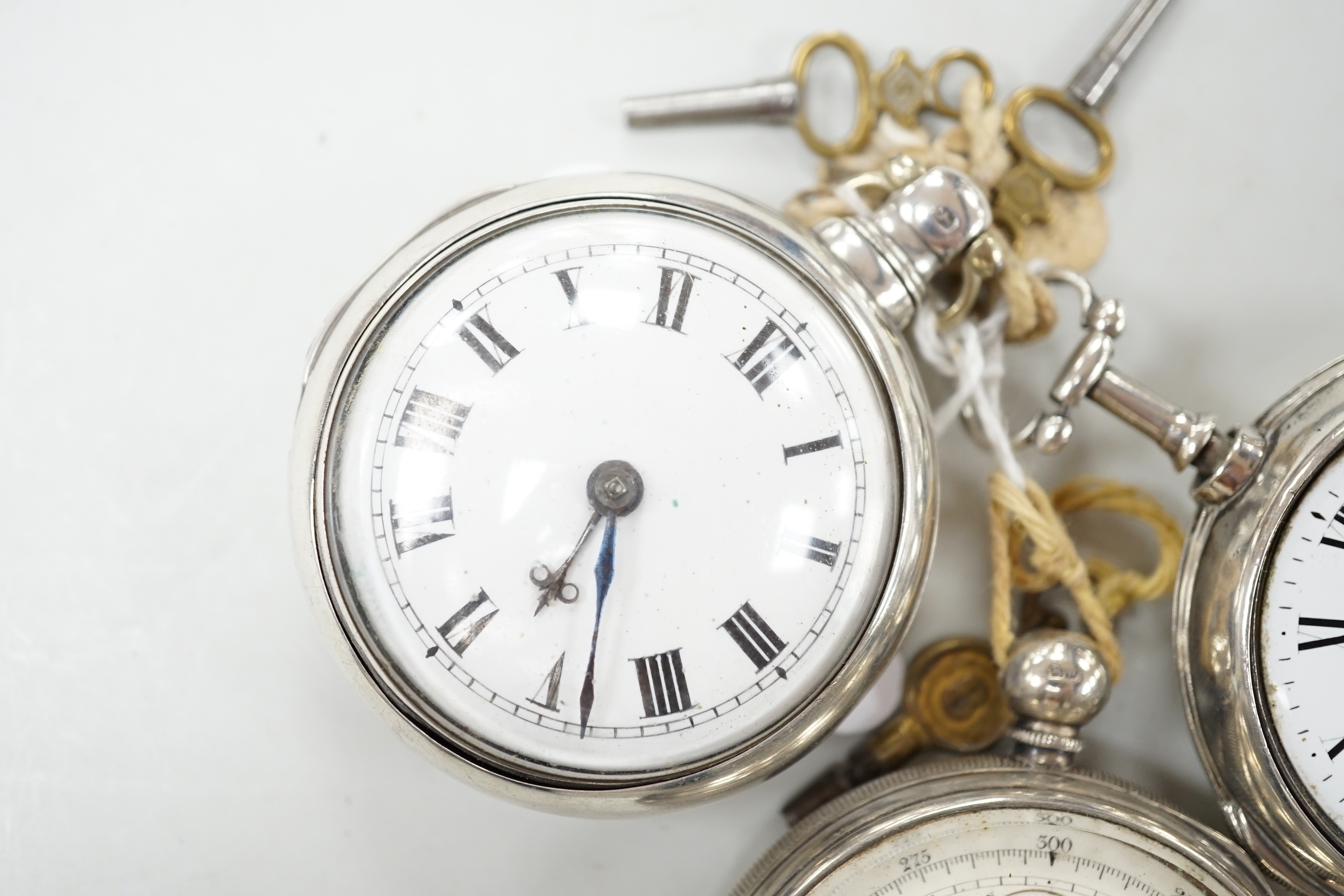 Three assorted silver pocket watches, including two pair cased and an open faced chronograph, by Aaronson, Manchester.